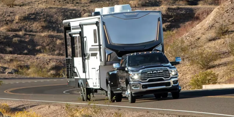 A 2026 RAM 3500 towing a 5th wheel camper.