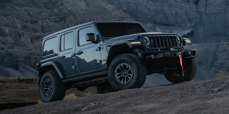 2026 Black Jeep Wrangler climbing rocks