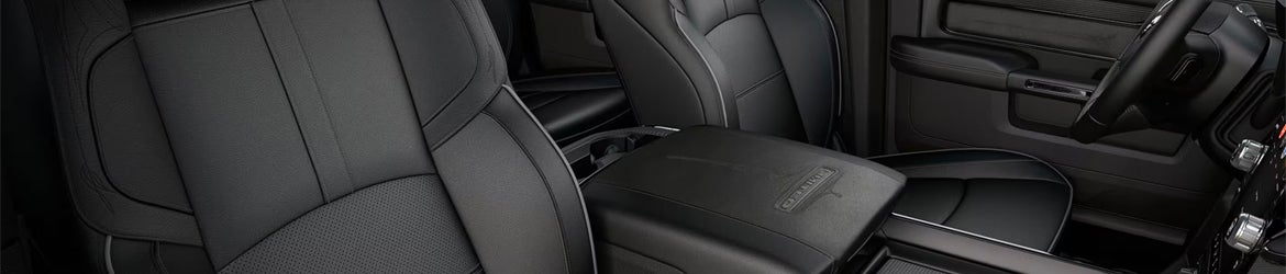 The arm rest space in the 2025 Ram 2500 in Starke, FL